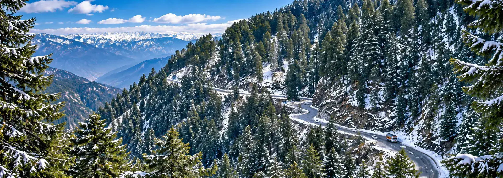 Snowy mountain road through Himalayan pine forests